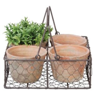 Aged terracotta pots in metal basket