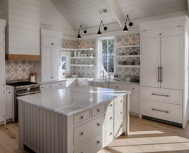 White coastal kitchen with modern farmhouse and Shaker designer elements. Lisa Furey created a welcoming home with shiplap, nods to coastal design, and blue accents. #coastalkitchen #modernfarmhousekitchen #kitchendesign #shiplap #shakerkitchen