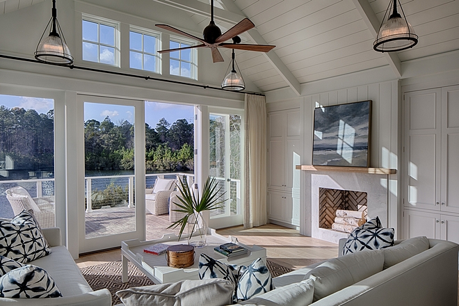 Living room. Board and batten coastal cottage in Palmetto Bluff with modern farmhouse interior design by Lisa Furey.