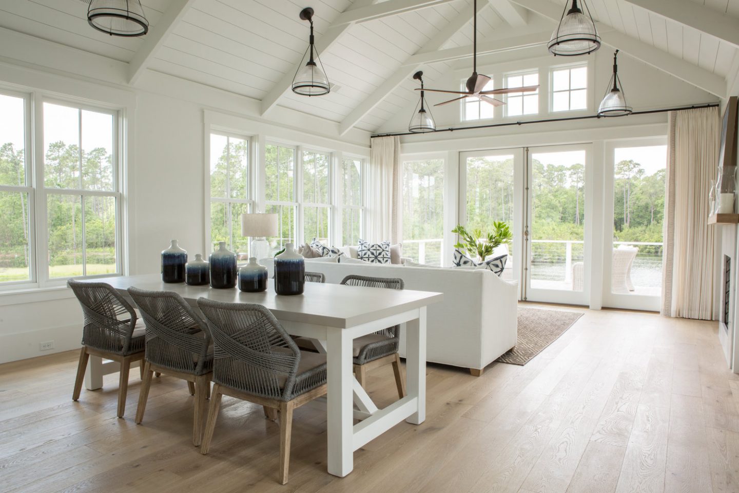 Living room. Board and batten coastal cottage in Palmetto Bluff with modern farmhouse interior design by Lisa Furey.