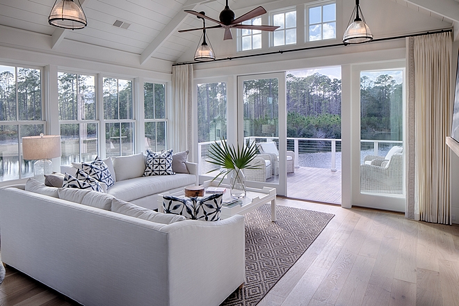 Living room. Board and batten coastal cottage in Palmetto Bluff with modern farmhouse interior design by Lisa Furey.