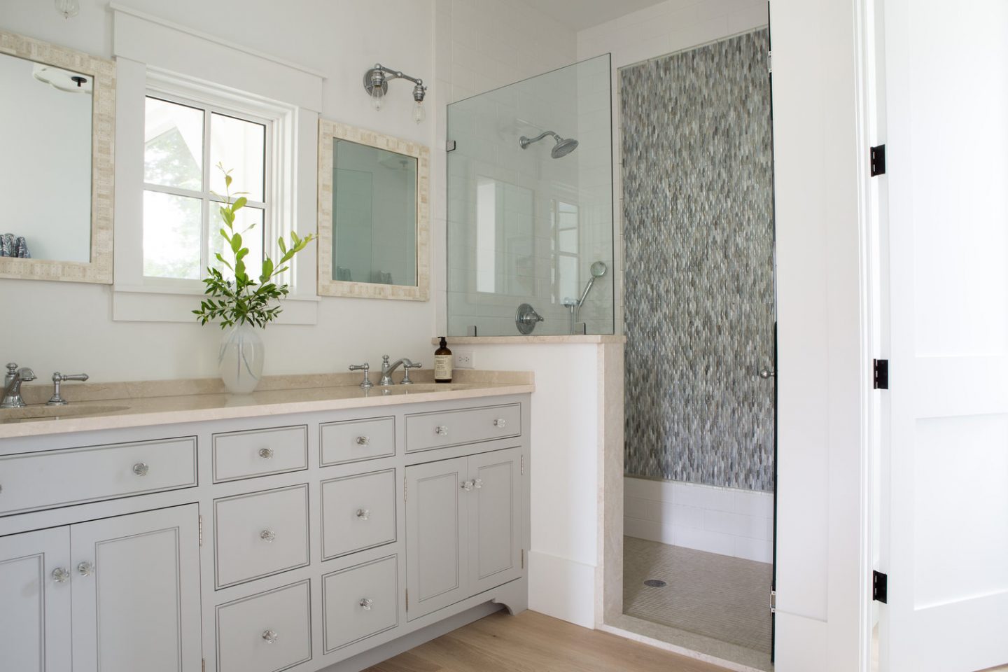 Master bath. Board and batten coastal cottage in Palmetto Bluff with modern farmhouse interior design by Lisa Furey.