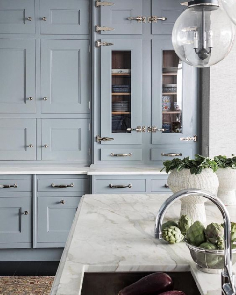 Light blue kitchen cabinets (try Farrow and Ball Parma Gray for this color), white marble countertop, and dramatic cabinet hardware. #blueandwhite #bluekitchen #kitchendesign #kitchendecor #decorinspiration #beautifulkitchen #kitchendesign #bluecabinets #bluekitchen