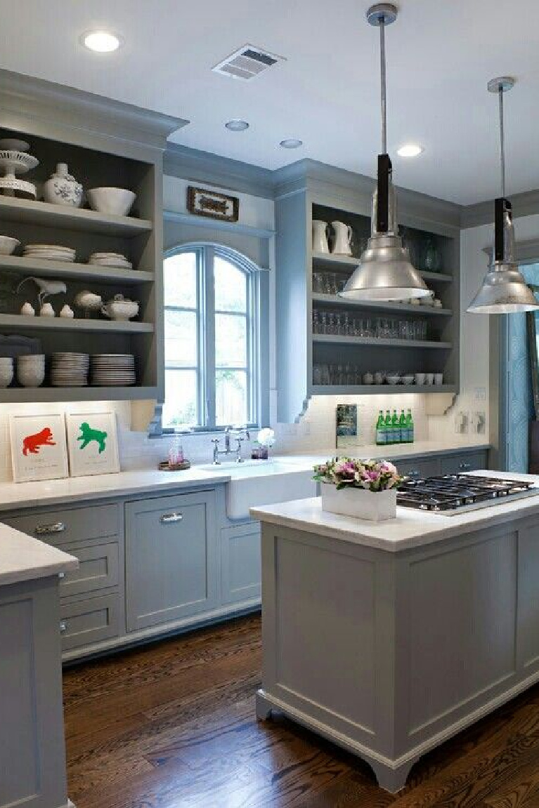 Sally Wheat kitchen with grey blue cabinets and uppers without doors. #frenchcountrykitchen