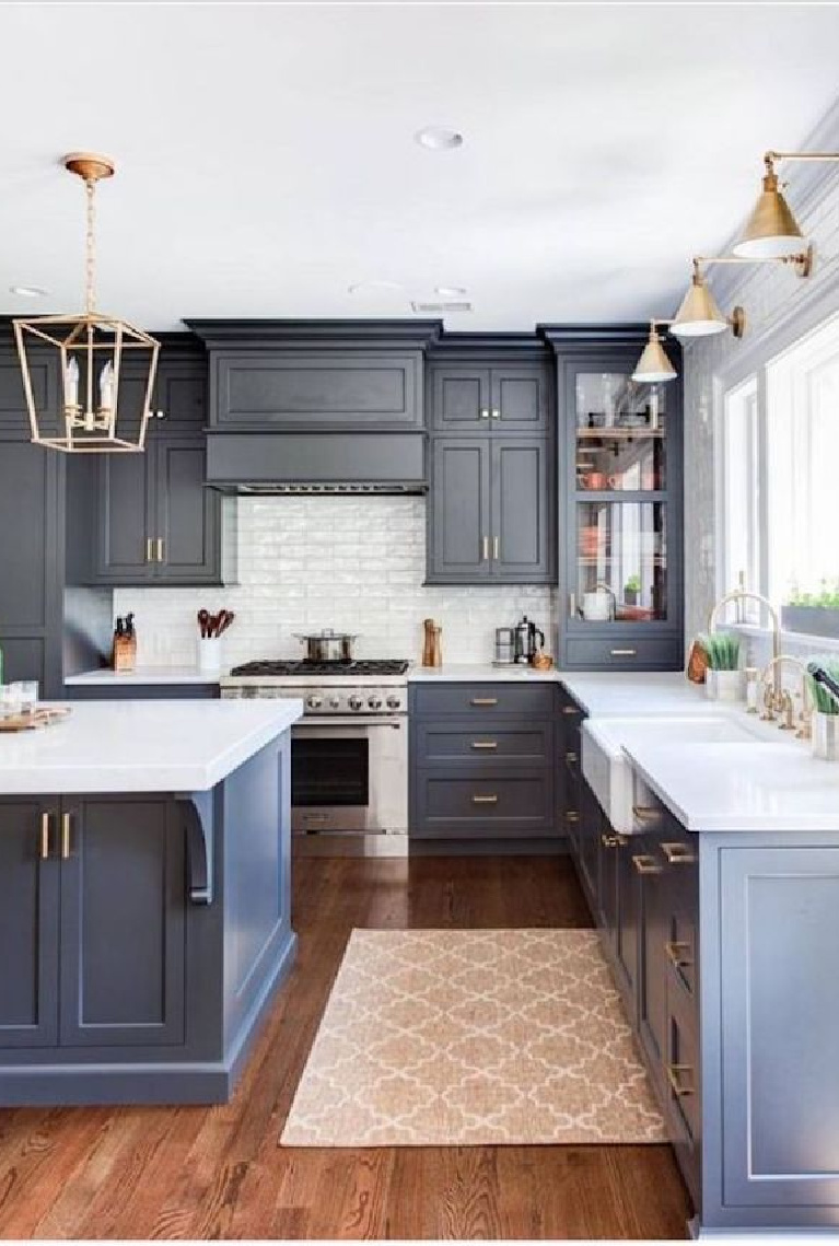 Slate blue kitchen cabinets and brass lighting in this classic kitchen. Come see 36 Best Beautiful Blue and White Kitchens to Love! #blueandwhite #bluekitchen #kitchendesign #kitchendecor #decorinspiration #beautifulkitchen