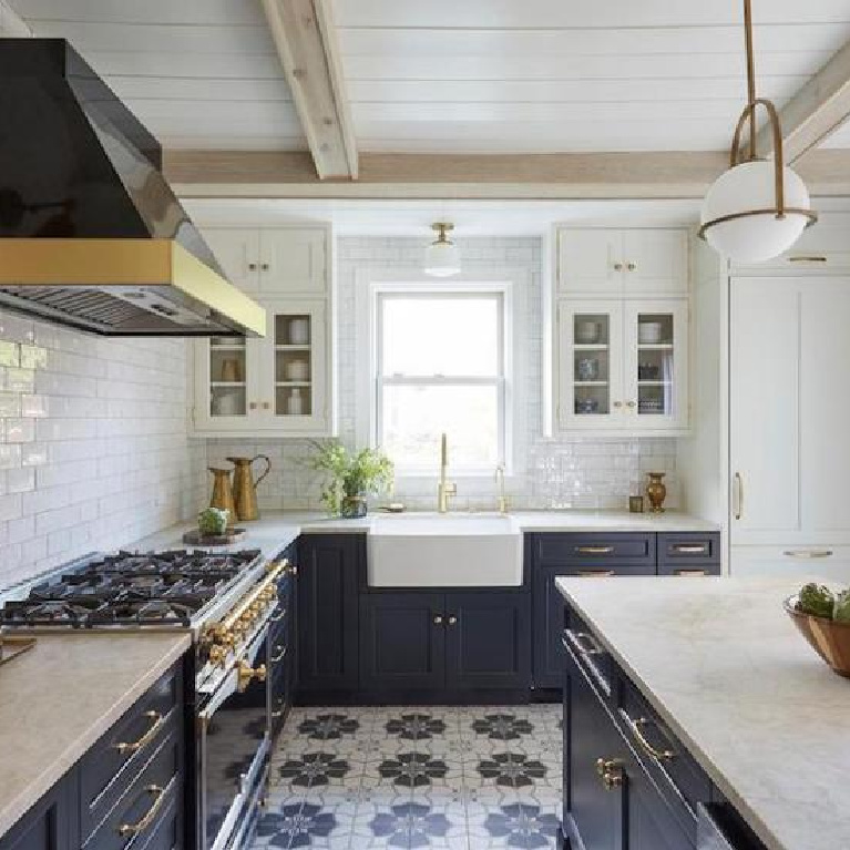 Navy blue kitchen with cement tile floor, subway tile, and midcentury modern pendant. Come see 36 Best Beautiful Blue and White Kitchens to Love! #blueandwhite #bluekitchen #kitchendesign #kitchendecor #decorinspiration #modernfarmhousekitchen
