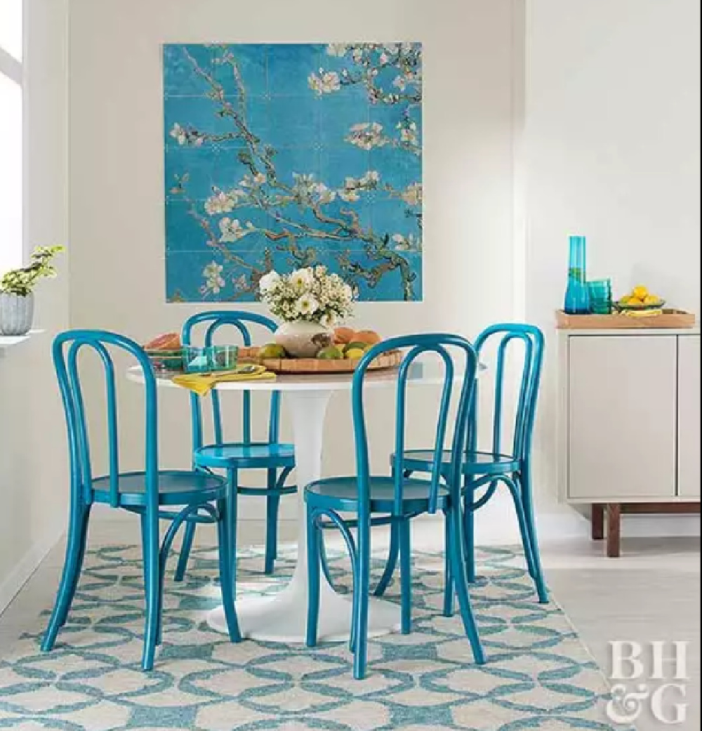 Turquoise blue bentwood chairs surround a tulip table in a breakfast area - BHG. #turquoise #interiordesign #breakfastnook
