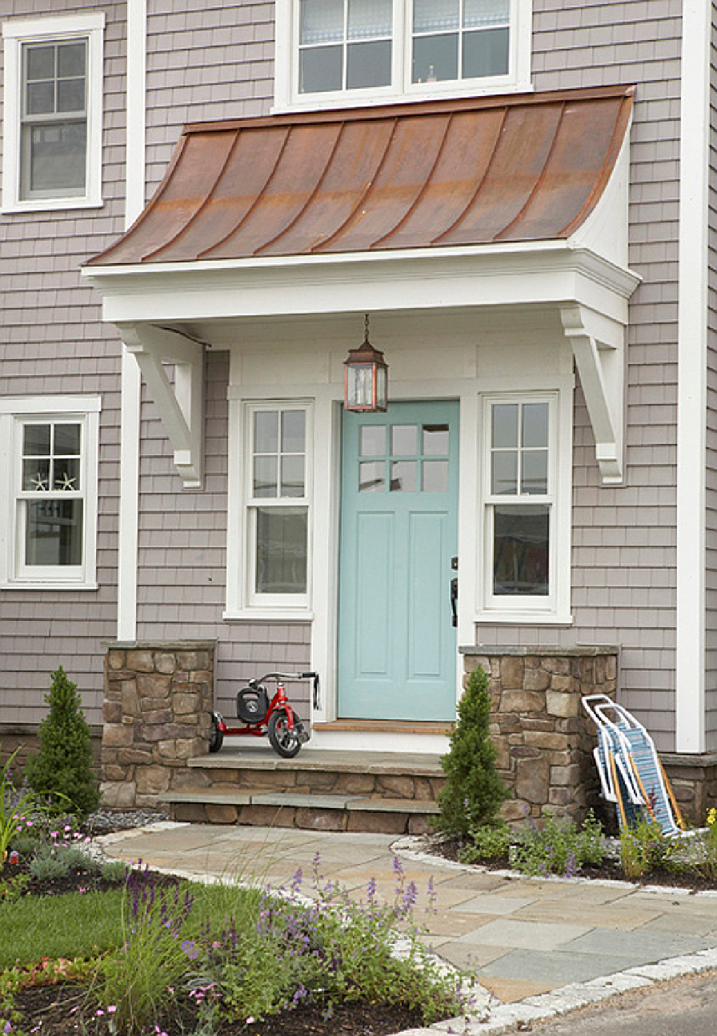 Pale blue aqua door to coastal cottage (Tracey Rapisardi) in Coastal Living Magazine. #coastalcottage #bluefrontdoor #houseexteriors