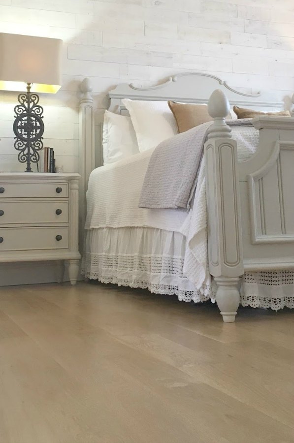 My bedroom with white oak wood floor, French country furniture, bronze overscaled lamp, and Stikwood (Hamptons) reclaimed wood plank statement wall behind bed. #hellolovelystudio #bedroomdecor #frenchcountry #rusticdecor #whiteoak #stikwood #hamptons #cottagestyle #shiplap