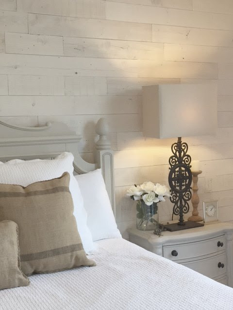 White wood plank accent wall in Hello Lovely's French Nordic cottage bedroom - easily installed DIY style! Visit: How We Turned an Ugly Wall Into a Design Feature!