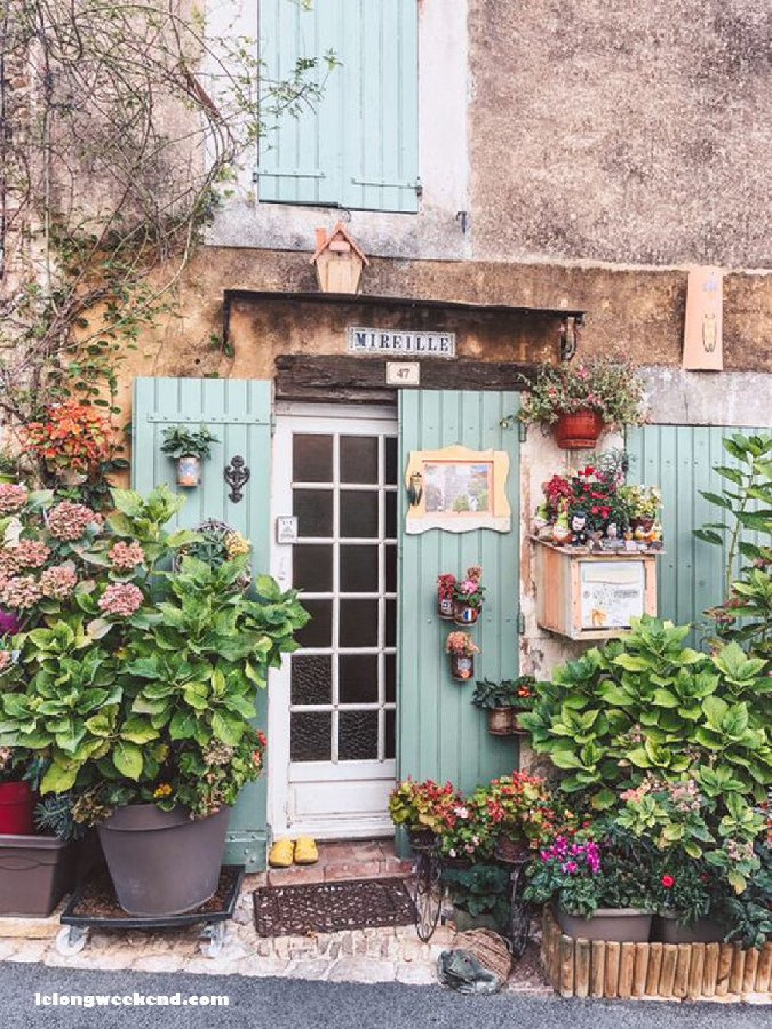 Aqua shutters on a rustic French exterior - LeLongWeekend. #frenchshutters #frenchblue #rusticfrench