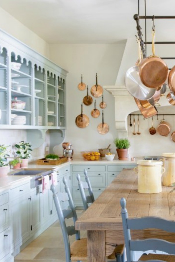 Only the prettiest French farmhouse kitchen with light blue cabinetry, copper pots, stone floor, and rustic refined elements ever! Mas des Poirers in Provence takes my breath away!