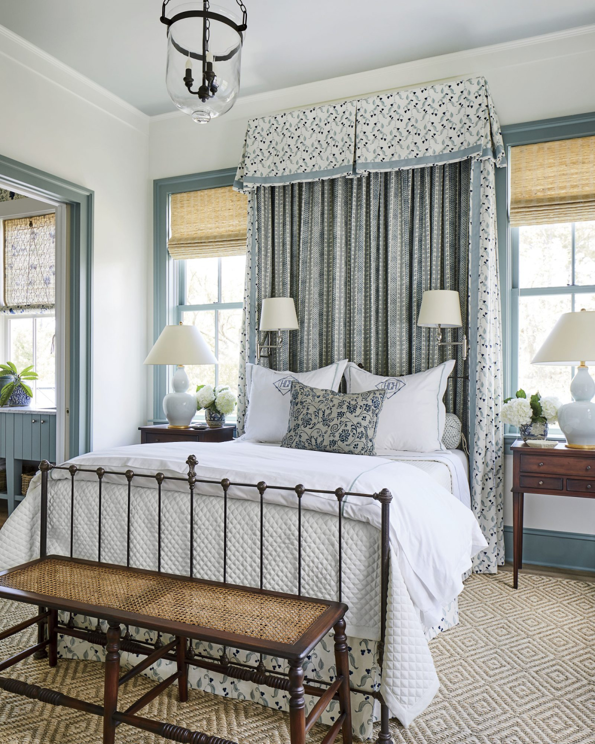 Dusty blue bedroom with charming fabric canopy and elegant design - Southern Living. #bluebedrooms #interiordesign #dustyblue