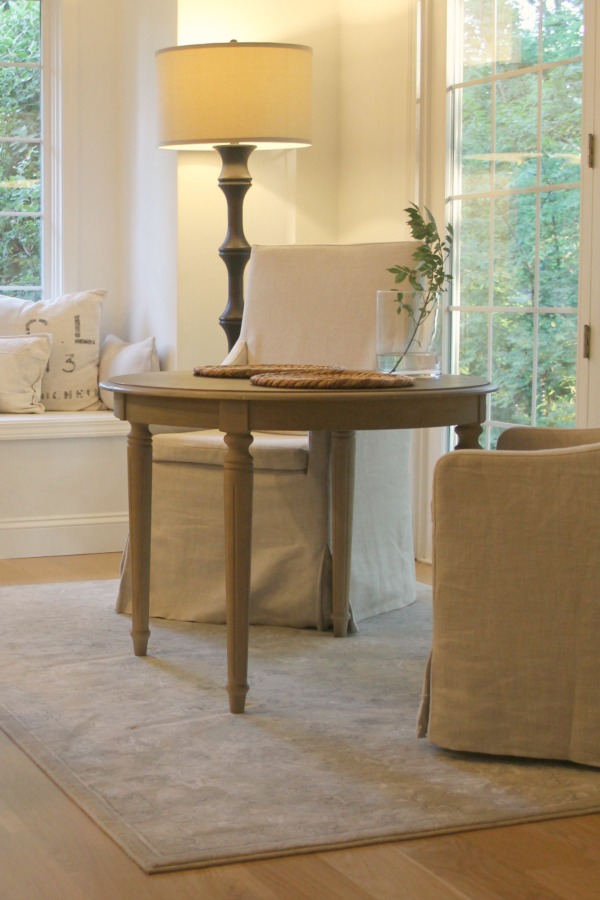 Window seat with linen pillows in European country inspired serene kitchen. Come see more of my home in Hello Lovely House Tour in July. #hellolovelystudio #timeless #tranquil #interiordesign #europeancountry #europeanfarmhouse #simpledecor #serenedecor