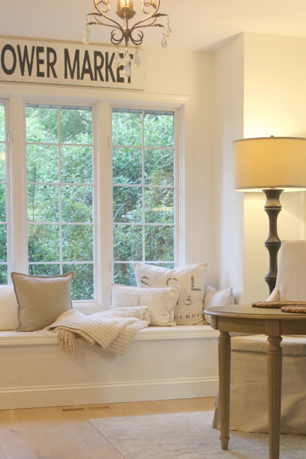 Serene and white decor in my kitchen with window seat. Hello Lovely Studio.