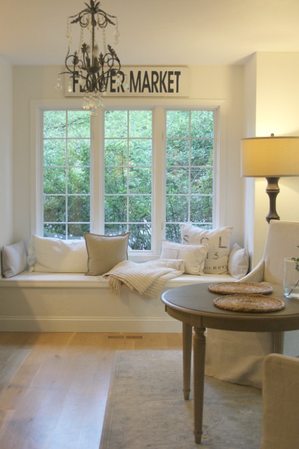 Window seat with linen pillows in European country inspired serene kitchen. Come see more of my home in Hello Lovely House Tour in July. #hellolovelystudio #timeless #tranquil #interiordesign #europeancountry #europeanfarmhouse #simpledecor #serenedecor