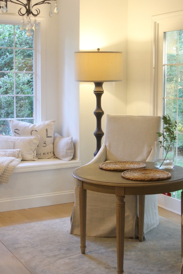 My serene and neutral European country kitchen with window seat and breakfast nook. Hello Lovely Studio.