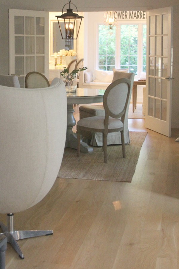 White oak hardwood flooring in a European inspired neutral home with spare interiors by Hello Lovely Studio. Learn more in this story about Wood Flooring Options: Engineered or Hardwood? #woodfloors #whiteoak #hellolovelystudio