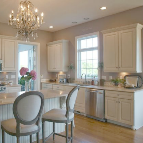 French country kitchen with grey walls and ivory cabinets. Hello Lovely Studio.