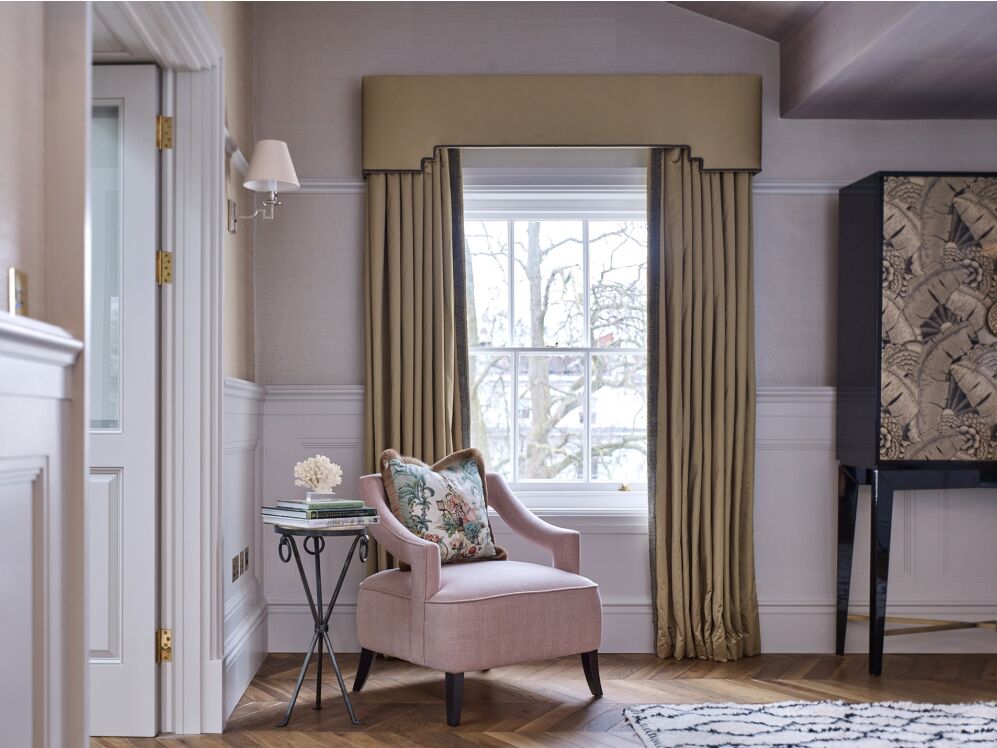 Blush pink chair in Sitting room in London apartment. Colorful Classic Decor in London Inspired by 'Out of Africa' - come see more from Studio L London! #britishcolornial #livingroom #pinkandgreen #elegantdecor #Londonapartment #interiordesigninspiration