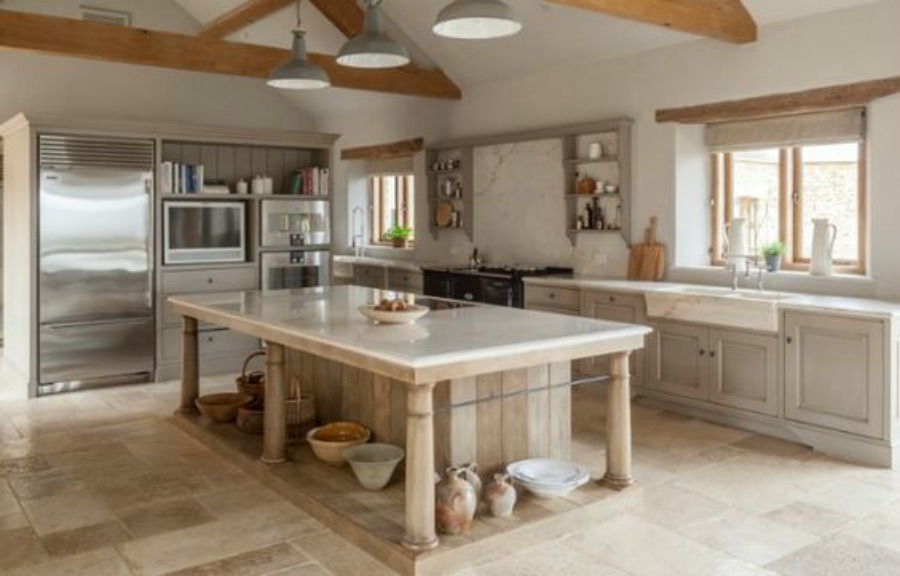 Modern rustic bespoke kitchen by Artichoke in Gloucestershire, England. Flemish design details, painted kitchen cabinetry, bronze hardware, and Bental White marble