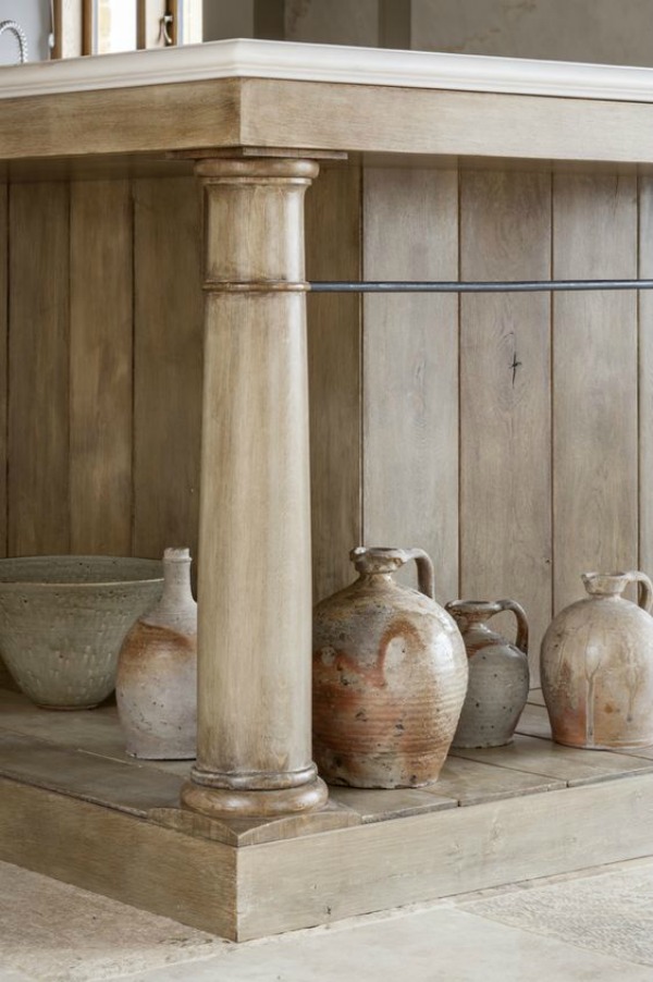 Detail of central wood island. Modern rustic bespoke kitchen by Artichoke in Gloucestershire, England. Flemish design details, painted kitchen cabinetry, bronze hardware, and Bental White marble