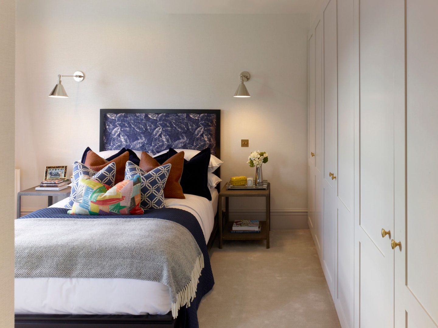 Bedroom with blue print headboard in London apartment. Colorful Classic Decor in London Inspired by 'Out of Africa' - come see more from Studio L London! #britishcolornial #livingroom #pinkandgreen #elegantdecor #Londonapartment #interiordesigninspiration