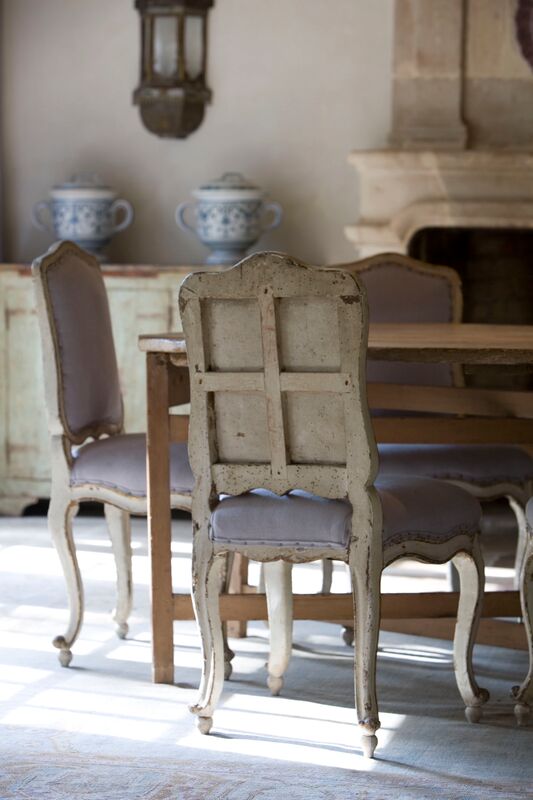 Chateau Domingue Timeless European Elegance and French farmhouse style converge in this house tour of founder Ruth Gay's home on Hello Lovely. Pale and Lovely European Country White Interiors to Inspire with photo gallery. #chateaudomingue #rusticdecor #pamelapierce #elegantdecor #diningroom