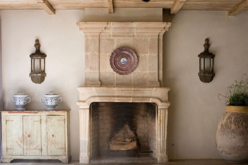 Chateau Domingue Timeless European Elegance and French farmhouse style converge in this house tour of founder Ruth Gay's home on Hello Lovely. Reclaimed stone, antique doors and mantels, and one of a kind architectural elements. #housetour #frenchcountry #frenchfarmhouse #europeanfarmhouse #chateaudomingue #rusticdecor #pamelapierce #elegantdecor #fireplace #ruthgay