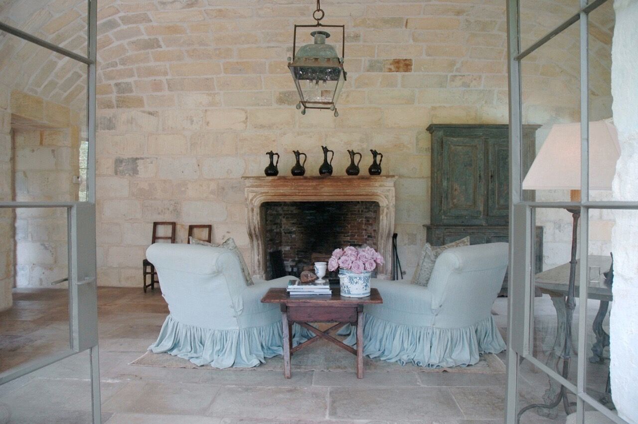 Magnificent French country rustic refined room with fireplace and reclaimed stone wall. Chateau Domingue. #frenchcountry #chateaudomingue #fireplace