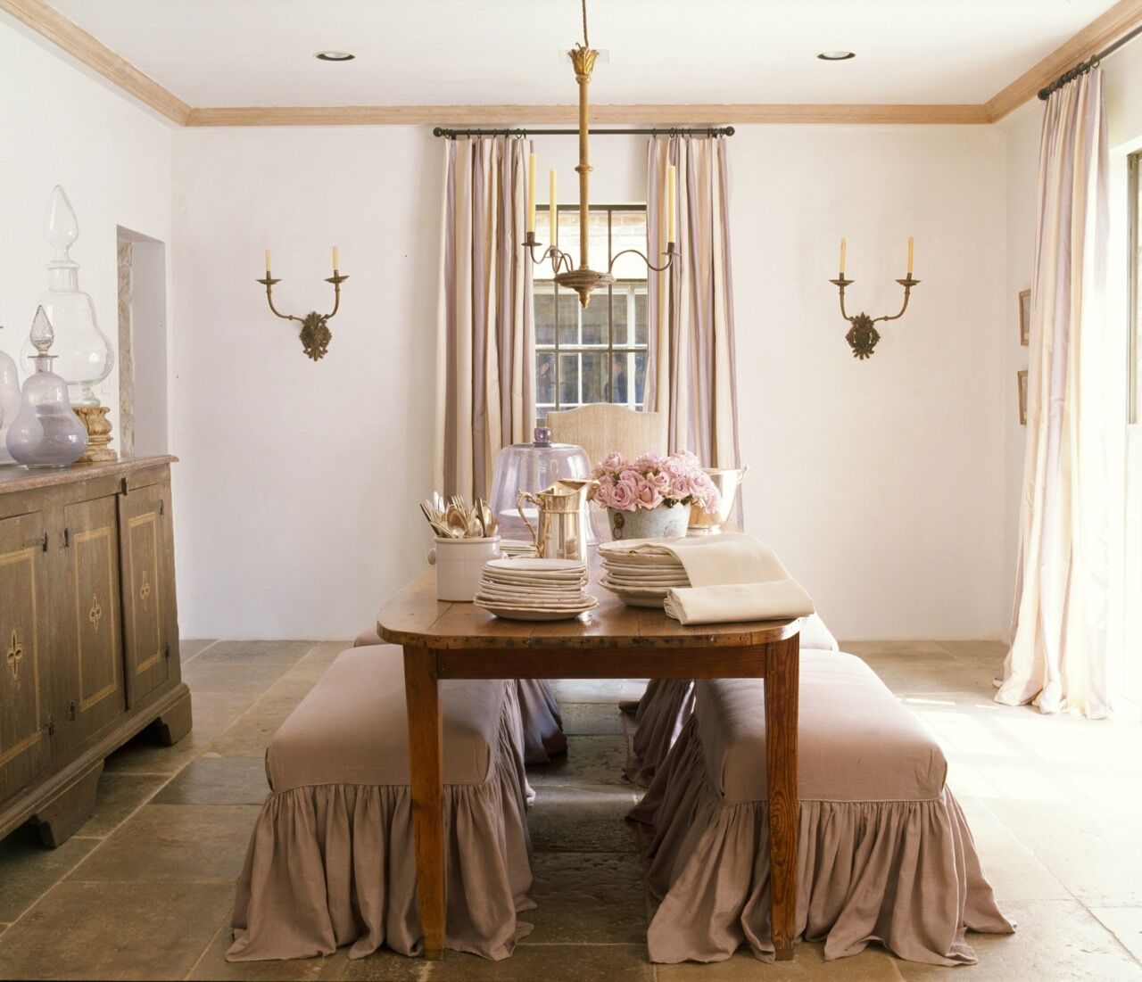 French country dining room of Ruth Gay - design by Pamela Pierce. Antiques and architectural elements sourced at Chateau Domingue. #chateaudomingue #diningroom #frenchcountry #frenchfarmhouse #pamelapierce #frenchinterior #frenchdiningroom #slipcovered #frenchinspired