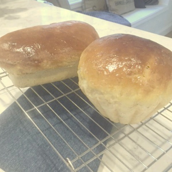 Sourdough bread cooling on a rack. #hellolovelystudio