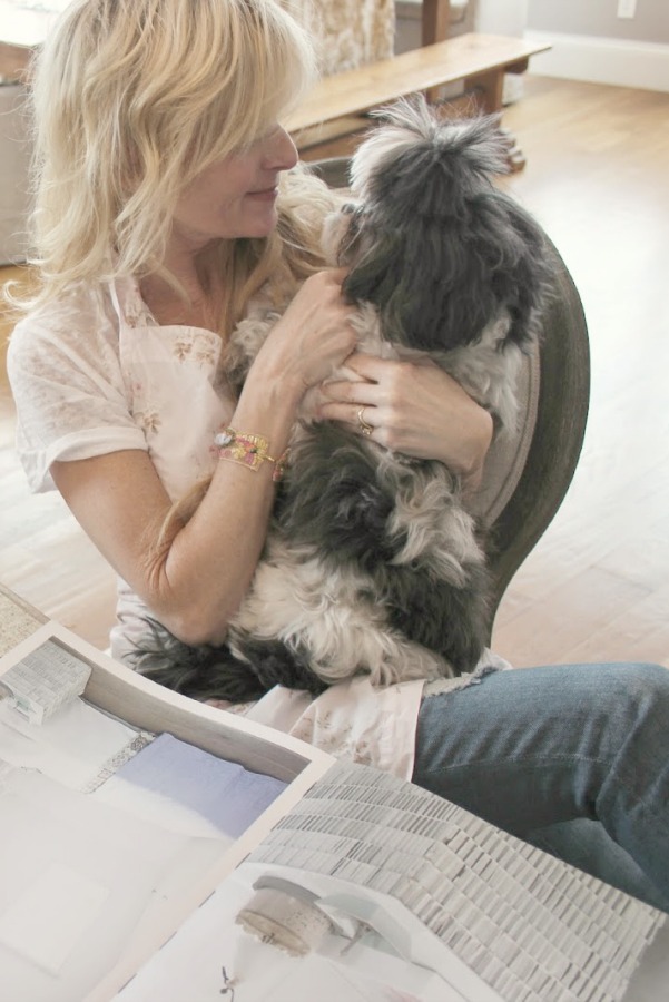 Michele of Hello Lovely Studio holding Bella Luna in her French Country kitchen - Hello Lovely Studio. Faith in the Valley & Healing in the Absence of Cure.