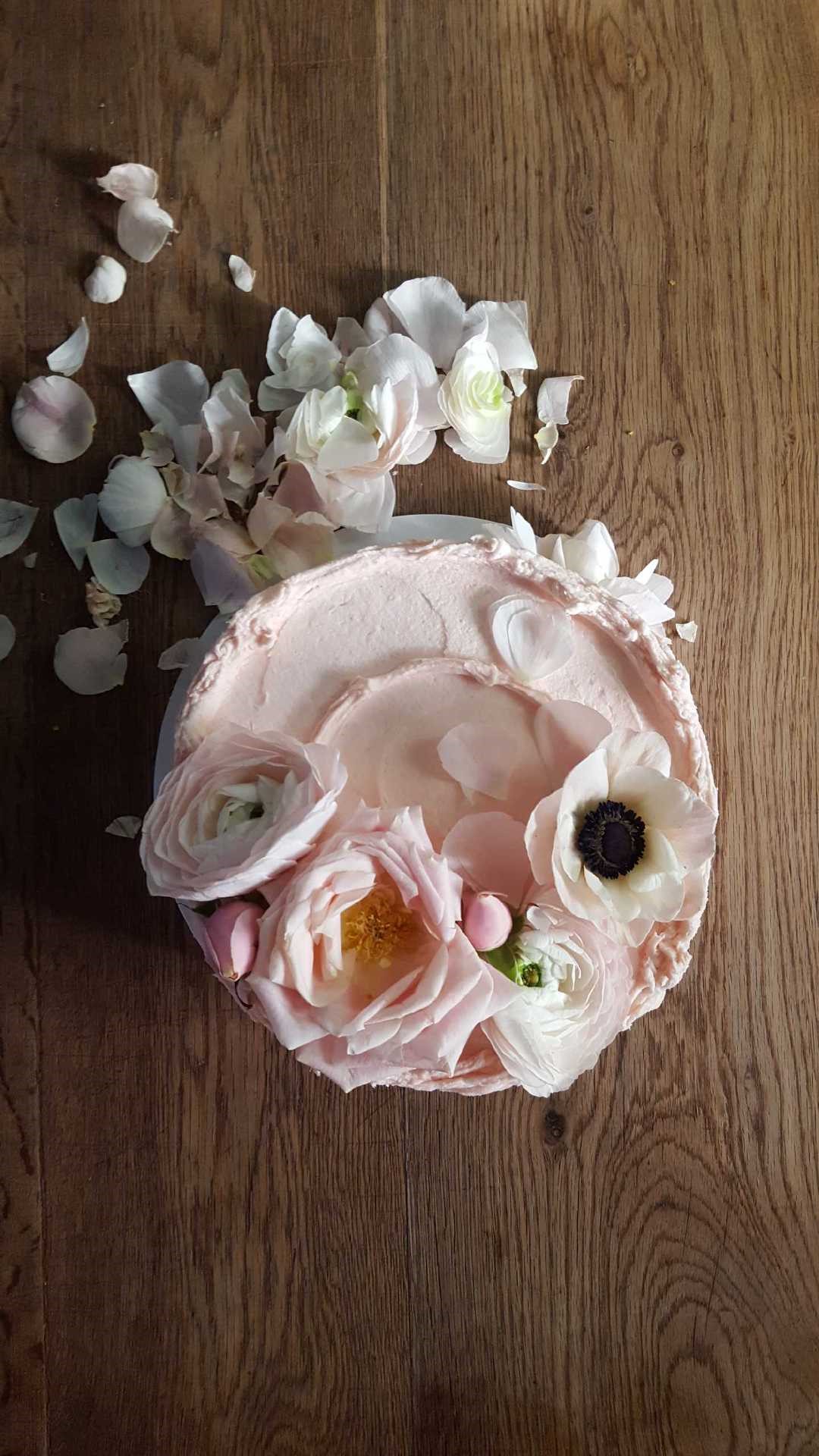 Pale pink old fashioned layer cake with fresh flowers on top. Beautiful cake styling from Violet bakery's Claire Ptak. Come see LET THEM EAT CAKE...VIOLET CAKES. #cakelover #violetbakery #violetcakes #claireptak #shabbychic #cakedecorating #letthemeatcake #bakingideas #bakingideas #cakestyling #cakequotes