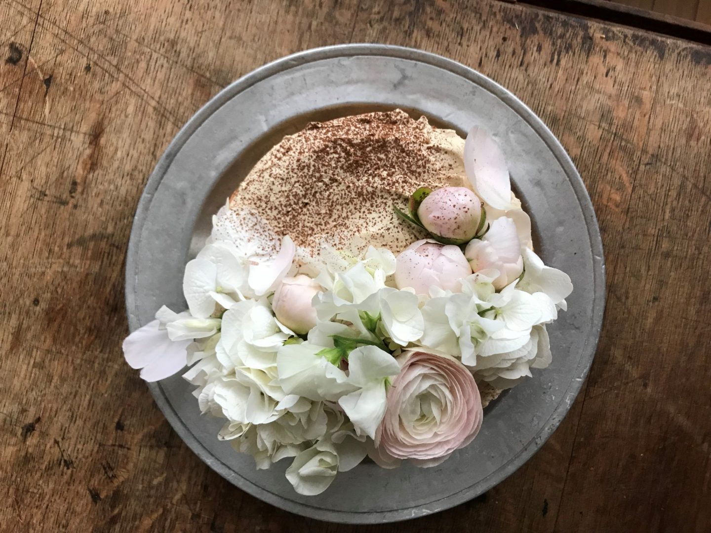 Old fashioned layer cake with fresh flowers on top. Beautiful cake styling from Violet bakery's Claire Ptak. Come see LET THEM EAT CAKE...VIOLET CAKES. #cakelover #violetbakery #violetcakes #claireptak #shabbychic #cakedecorating #letthemeatcake #bakingideas #bakingideas #cakestyling #cakequotes