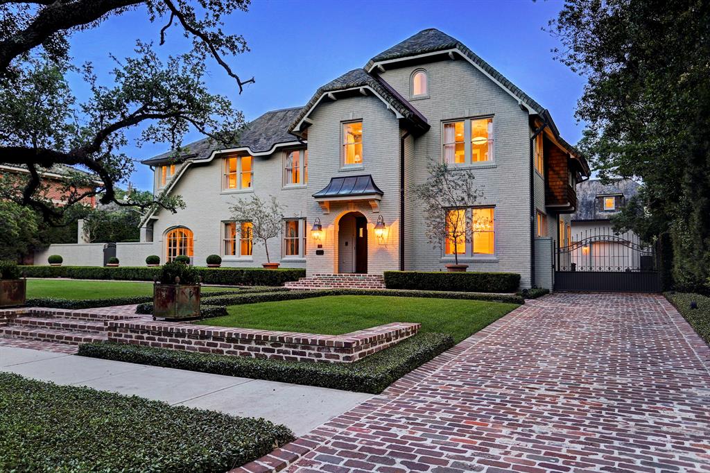 Exterior of Tudor Revival. Luxurious interior design details in a Tudor Revival house renovation in Houston. Design consultant: Pam Pierce. Many reclaimed antique materials from Chateau Domingue. #housetour #oldworld #pampierce #chateaudomingue #europeanantiques #luxurioushome #interiordesignideas #Frenchcountry #limestone #reclaimedflooring #bespoke #houstonhome