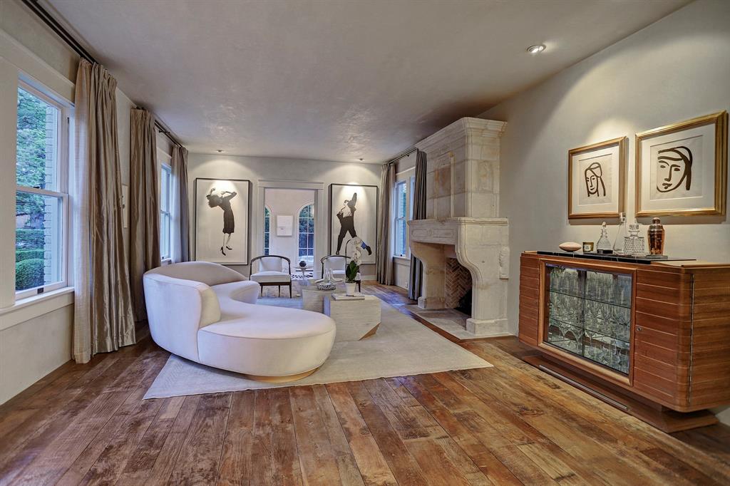 Sophisticated living room. Luxurious interior design details in a Tudor Revival house renovation in Houston. Design consultant: Pam Pierce. Many reclaimed antique materials from Chateau Domingue. #housetour #oldworld #pampierce #chateaudomingue #europeanantiques #luxurioushome #interiordesignideas #Frenchcountry #limestone #reclaimedflooring #bespoke #houstonhome