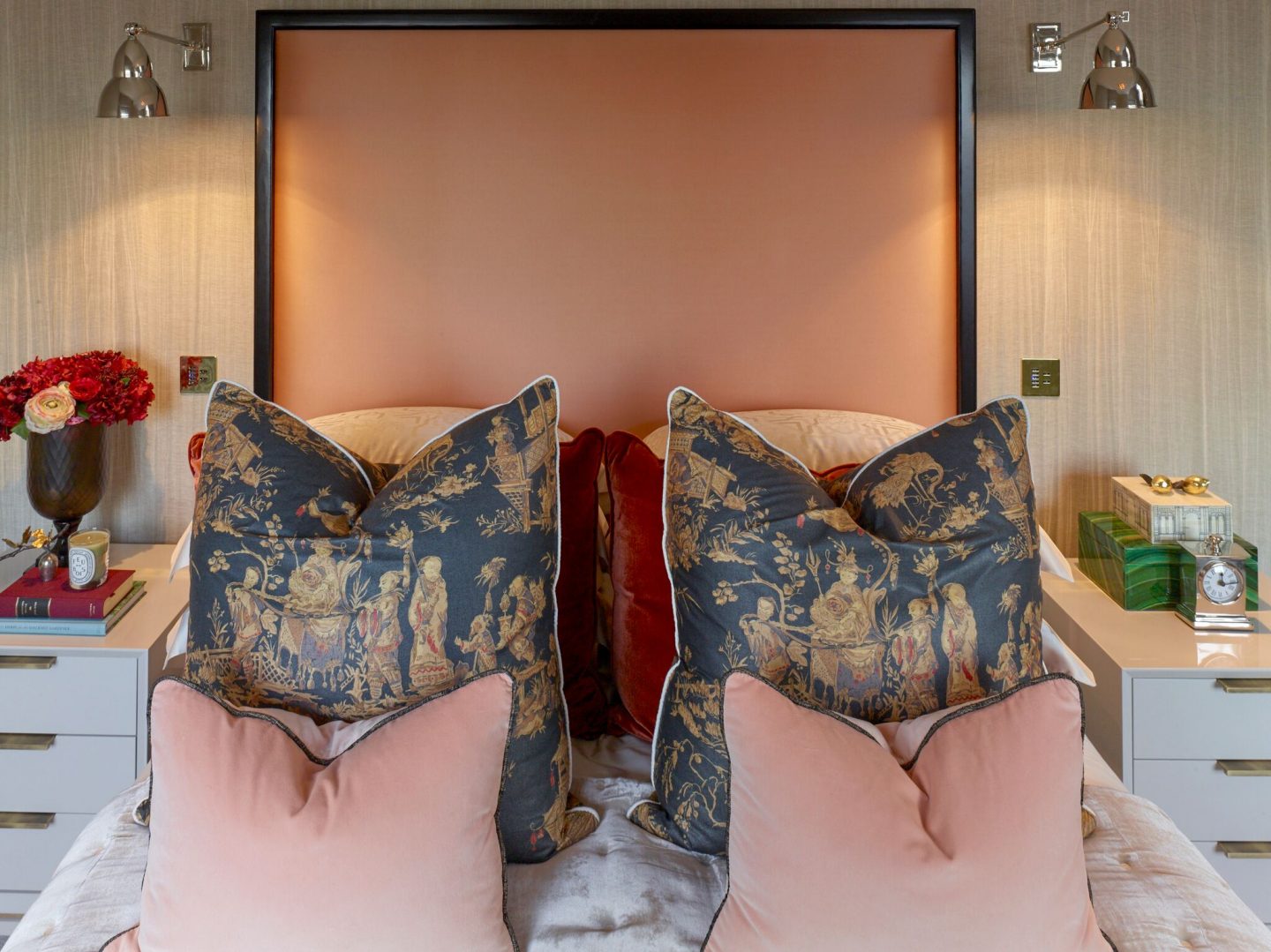 Peach headboard in in London apartment. Colorful Classic Decor in London Inspired by 'Out of Africa' - come see more from Studio L London! #britishcolornial #livingroom #pinkandgreen #elegantdecor #Londonapartment #interiordesigninspiration