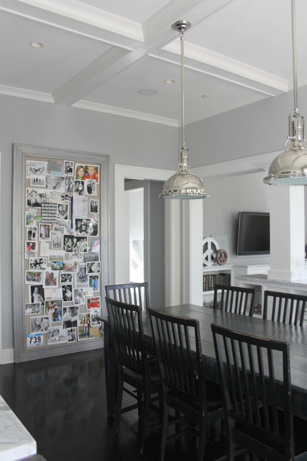 Breakfast dining nook in a modern farmhouse with black hardwood floors and Stonington Gray wall color.