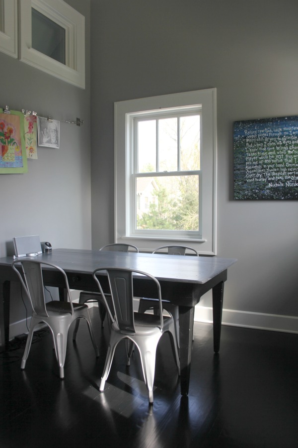 Farm table and metal French farmhouse chairs in craft room. Modern Industrial Farmhouse Bedroom Design {2nd Floor Tour}. #modernfarmhouse #bedroom #industrialfarmhouse #greywalls #luxuriousfarmhouse #benjaminmooreplatinum #benjaminmoorestoningtongray