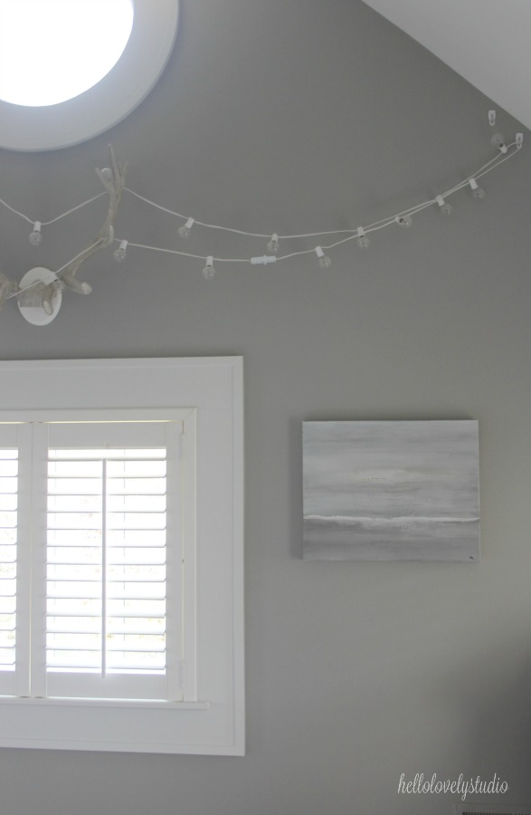 Abstract seascape in greys by Michele of Hello Lovely. Modern Industrial Farmhouse Bedroom Design {2nd Floor Tour}. #modernfarmhouse #bedroom #industrialfarmhouse #greywalls #luxuriousfarmhouse #benjaminmooreplatinum #benjaminmoorestoningtongray