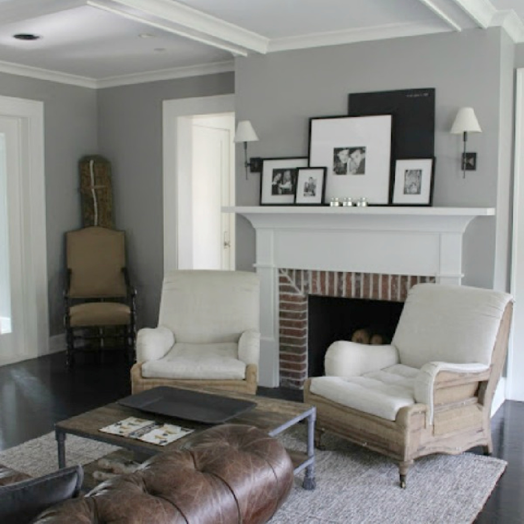 Deconstructed Belgian style armchairs from RH near the traditional fireplace in a modern farmhouse living room.