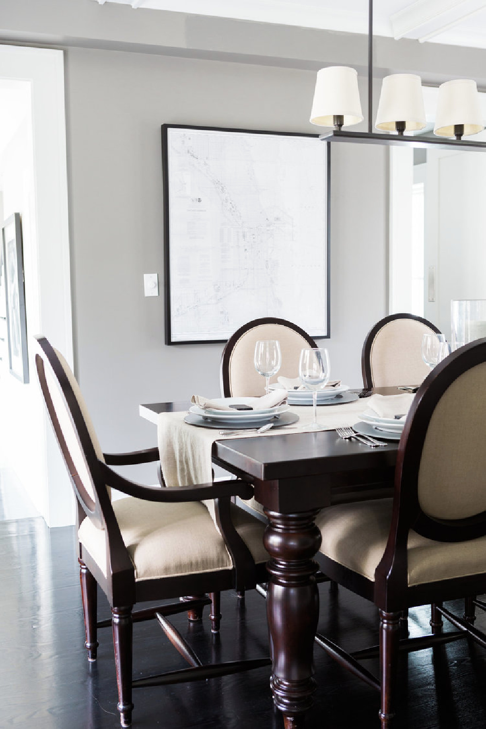 RH Dining room furnishings in a dining room with black hardwood floors and Stonington Gray walls - Hello Lovely Studio.