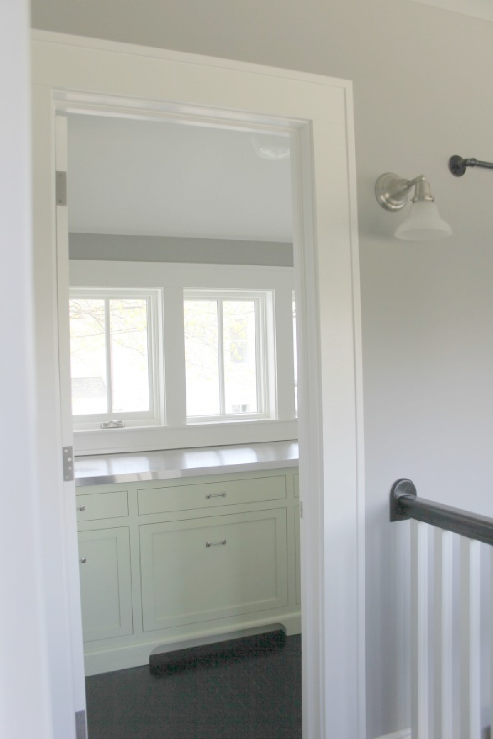 View into the butler pantry in a home with classic architecture - Hello Lovely Studio.