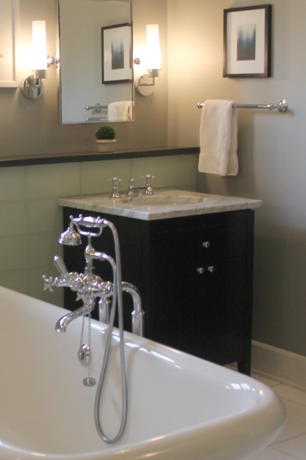 Black vanity, carrara marble top, and Waterworks bathtub. Modern Industrial Farmhouse Bedroom Design {2nd Floor Tour}. #modernfarmhouse #bedroom #industrialfarmhouse #greywalls #luxuriousfarmhouse #benjaminmooreplatinum #benjaminmoorestoningtongray