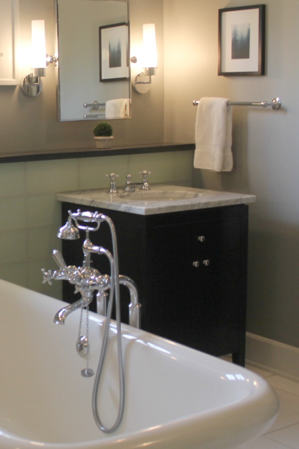 Black vanity, carrara marble top, and Waterworks bathtub. Modern Industrial Farmhouse Bedroom Design {2nd Floor Tour}. #modernfarmhouse #bedroom #industrialfarmhouse #greywalls #luxuriousfarmhouse #benjaminmooreplatinum #benjaminmoorestoningtongray