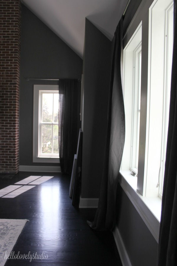 Serene and minimal interior design inspiration from an industrial farmhouse style bedroom with Benjamin Moore Platinum Gray paint color on walls. Photo: Hello Lovely Studio.