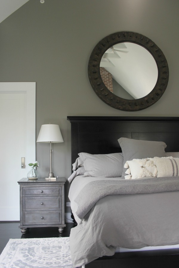 Grey walls in lofty modern farmhouse bedroom. Modern Industrial Farmhouse Bedroom Design {2nd Floor Tour}. #modernfarmhouse #bedroom #industrialfarmhouse #greywalls #luxuriousfarmhouse #benjaminmooreplatinum #benjaminmoorestoningtongray