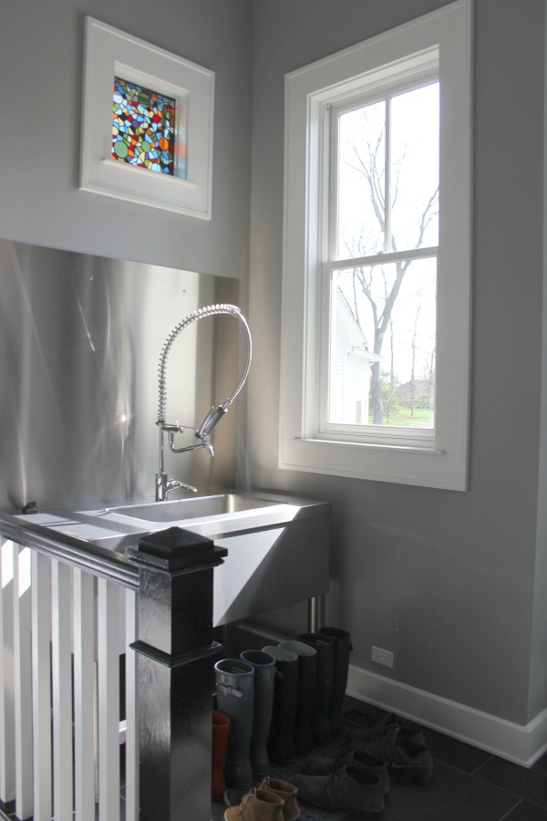 Modern farmhouse mud room with stained glass window and industrial farmhouse sink. #modernfarmhouse #mudroom #hellolovelystudio