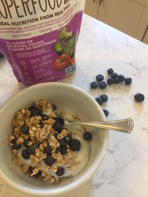 Smoothie in a bowl with Better Body Liv Fit Organic Superfood Blend, yogurt, blueberries, granola, and honey. Hello Lovely Studio. #smoothieinbowl #breakfast #superfood #livfit #betterbodyfoods